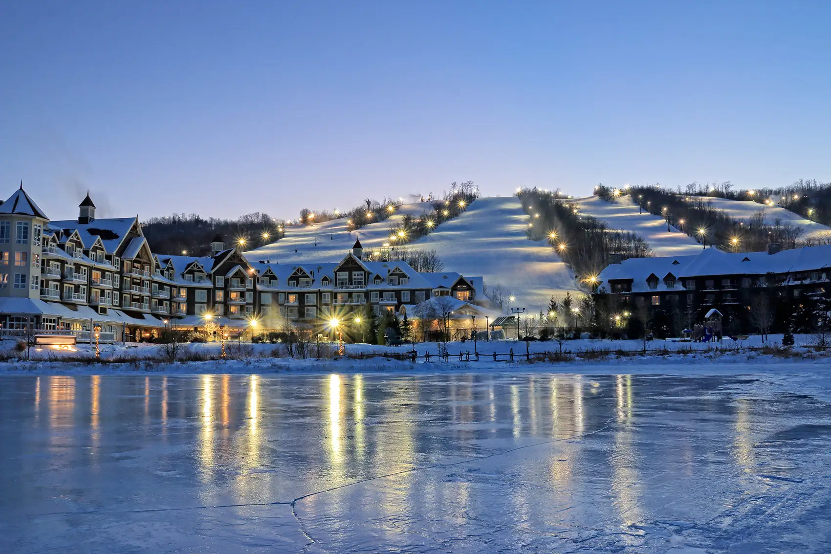 Blue Mountain village and ski hills lit up on a winter evening
