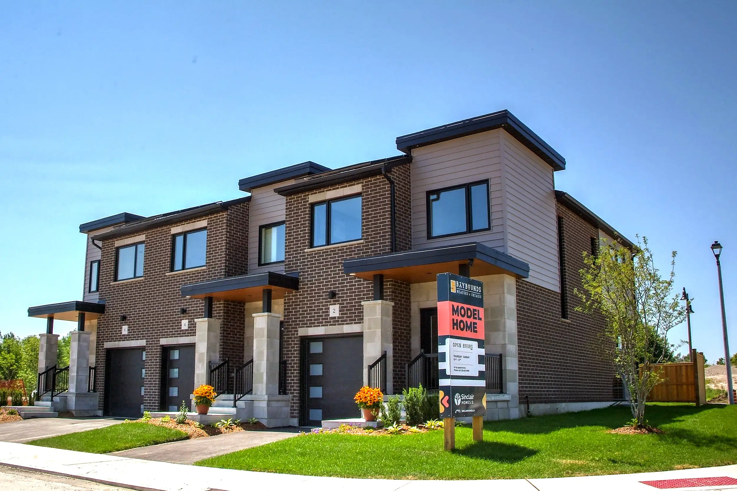 Baybounds model home townhomes with a Model Home sign